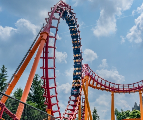 A loop-de-loop rollercoaster with orange tracks