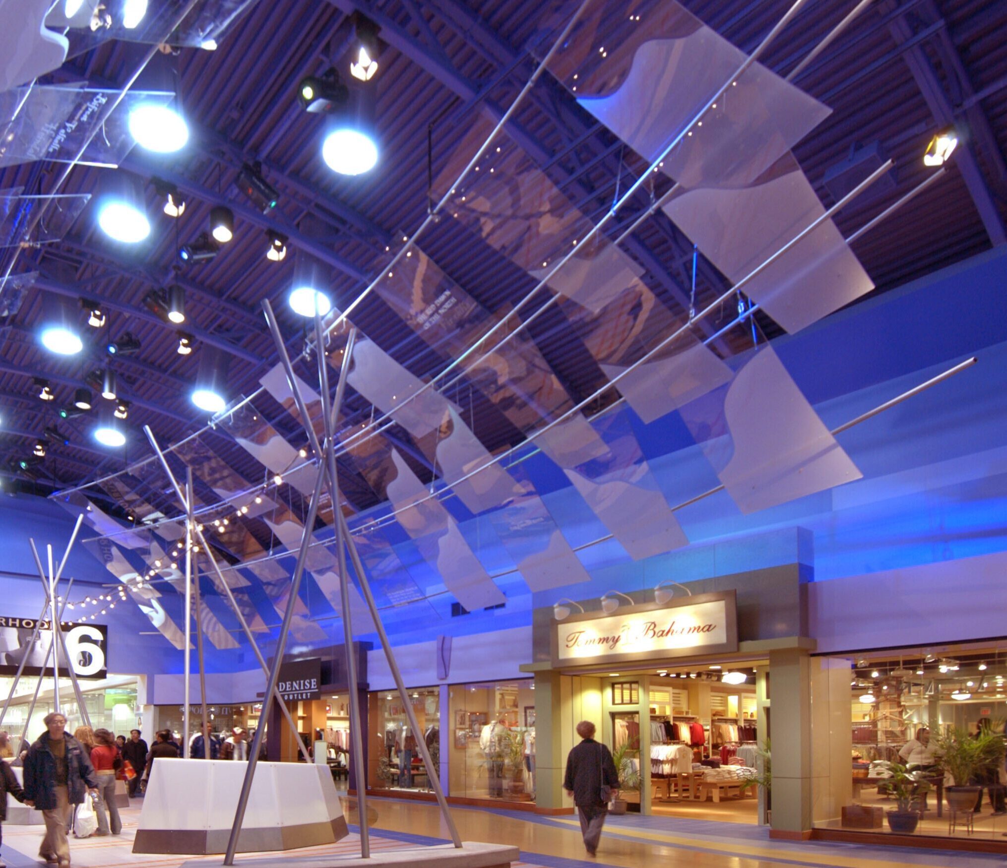 Interior of Vaughan Mills mall hallway Area 6, shoppers walking around with some stores in the background