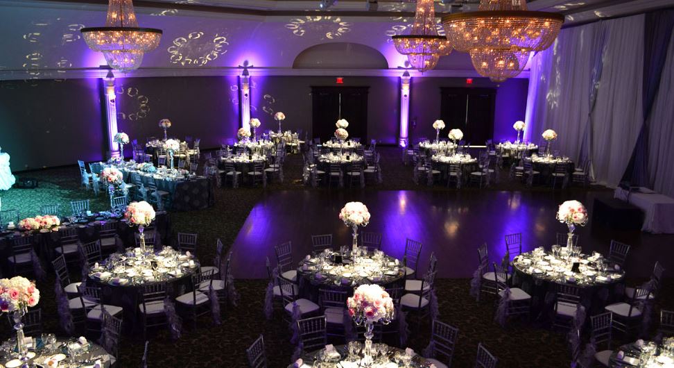 Banquet hall set up with purple lighting
