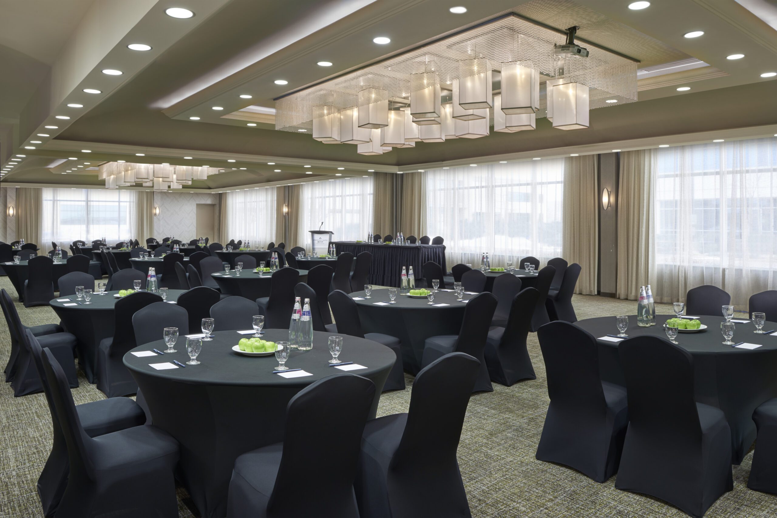 Conference room with round tables set up for an event
