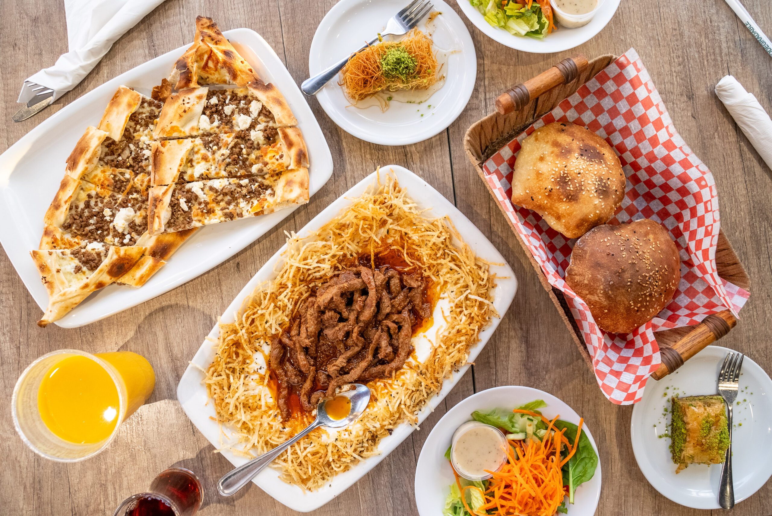 Image of many plates full of Turkish dishes on a table in a restaurant