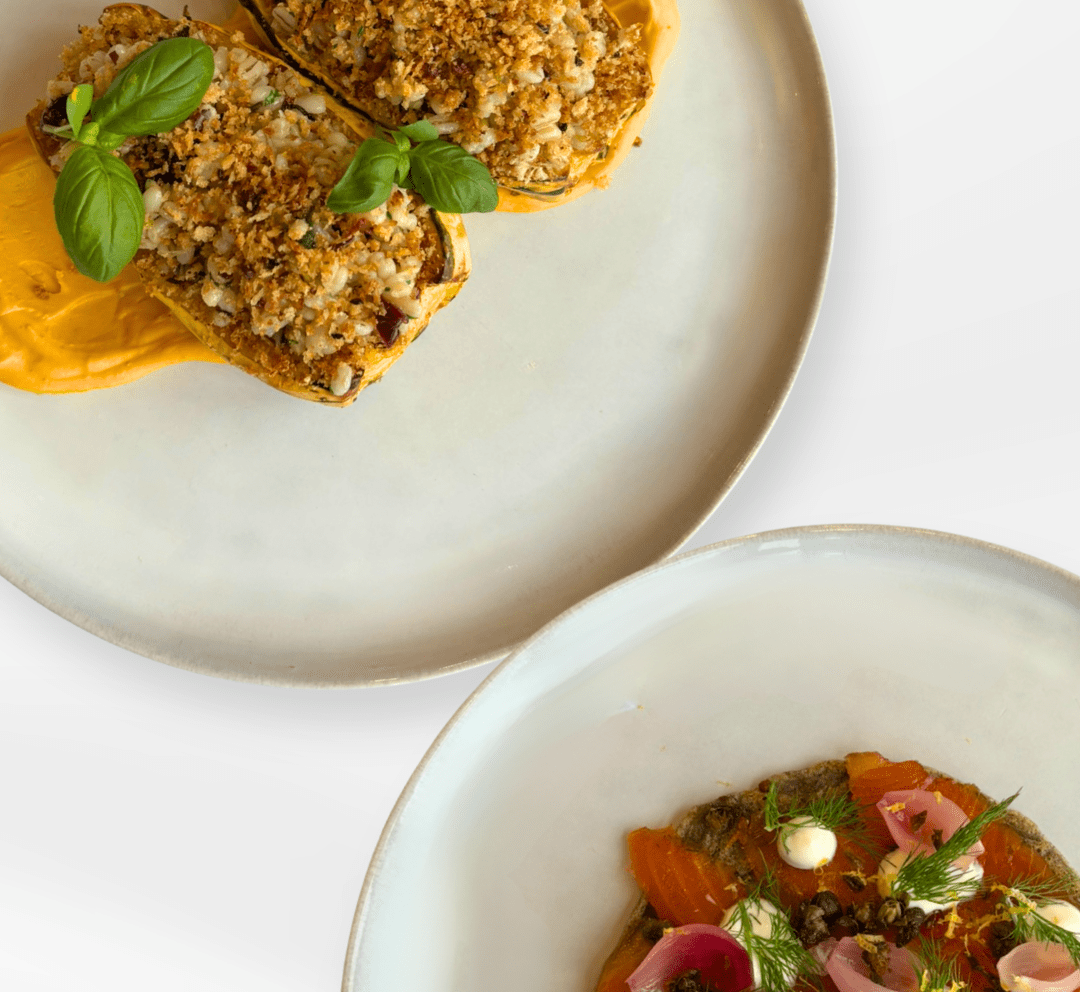 Image of two beautifully plated meals at a restaurant
