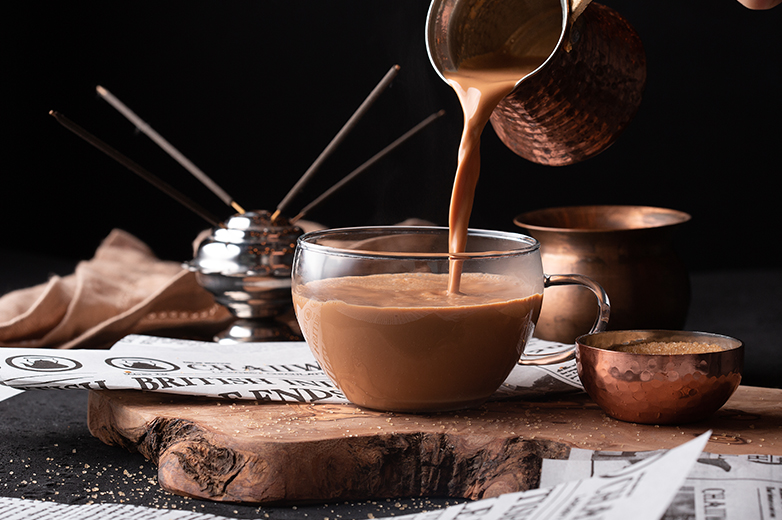 Image of a cup of chai being poured