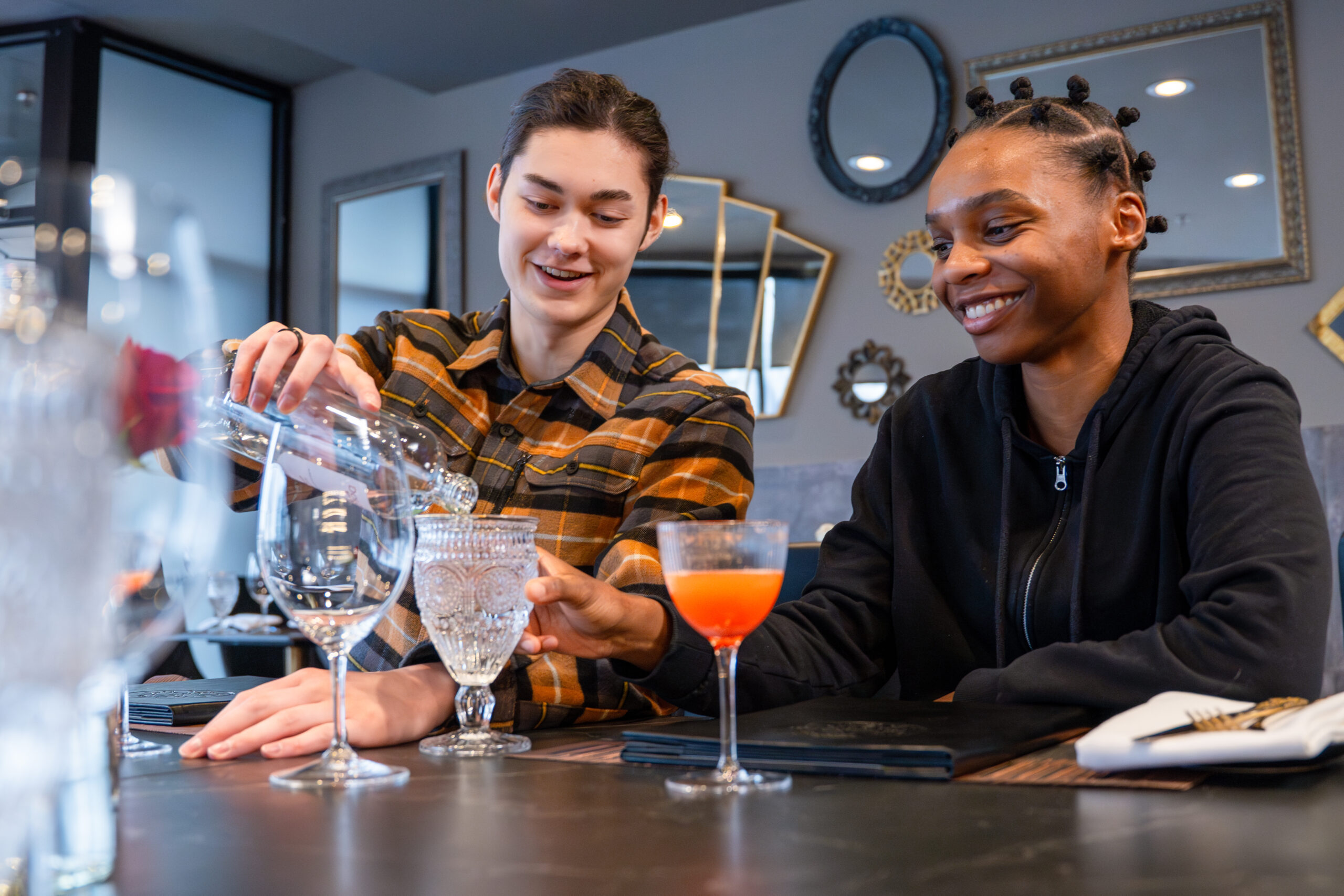 two people having cocktails