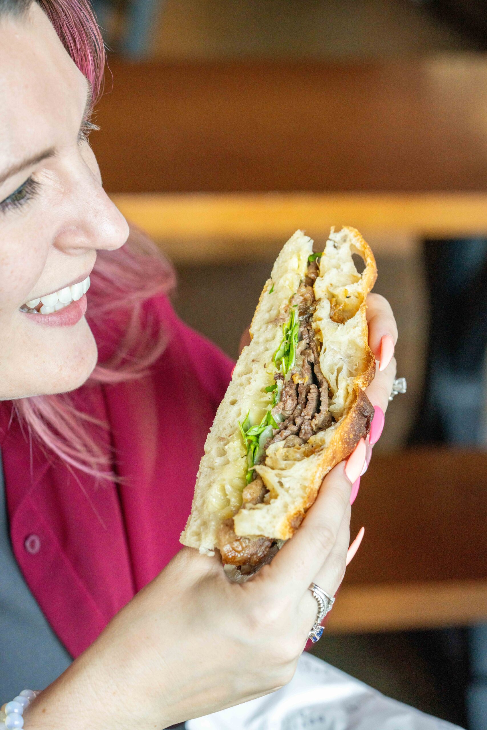 woman holding a sandwich