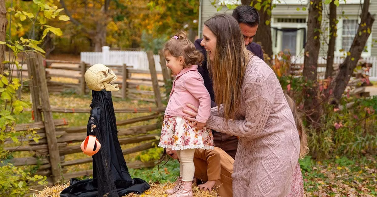 family with Halloween decorations